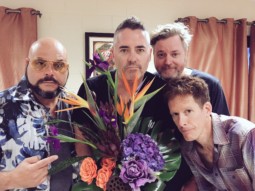 The Barenaked Ladies pose with a bouquet of flowers and offer an apology for offending Hoobastank.