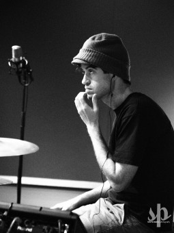 Nate Nelson, drummer for Lower Dens, contemplates for a moment during An Evening With Lower Dens at WTMD. (Photo by Steve Parke)